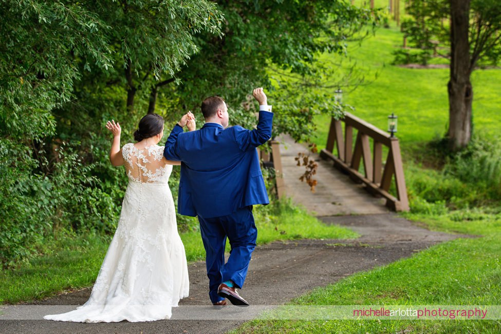 bride and groom cheer at New Jersey bear brook valley wedding
