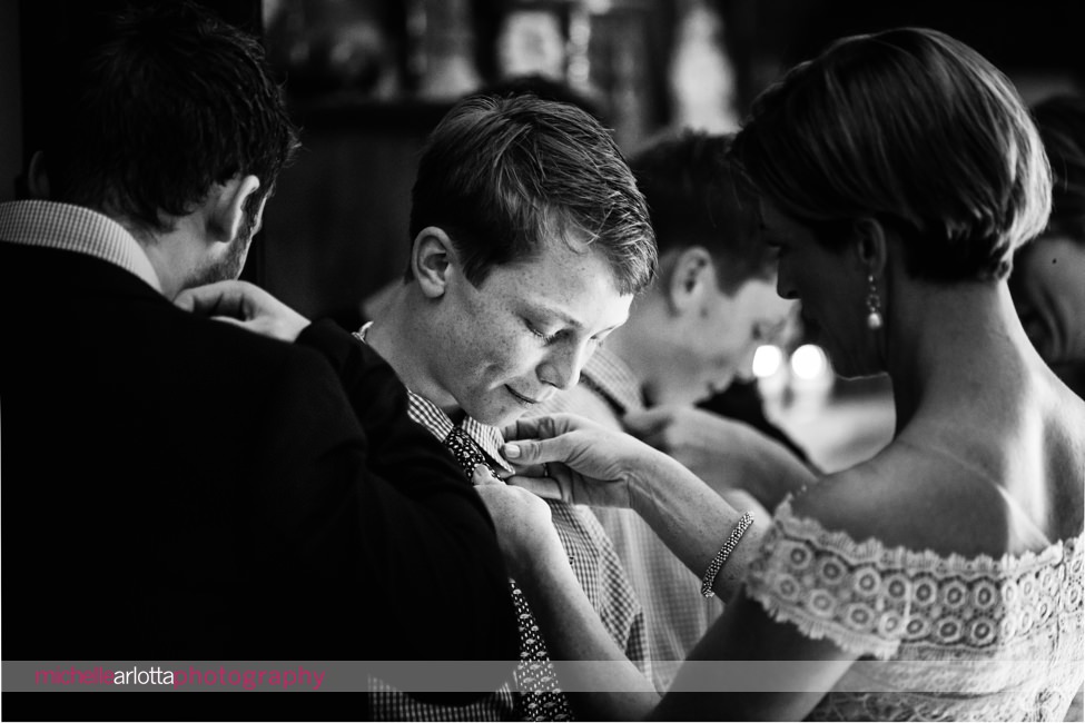 bride adjusts her son's tie for intimate gables inn wedding nj