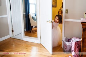 flower girl reacting to seeing bride in her miss Stella York wedding gown for nj wedding