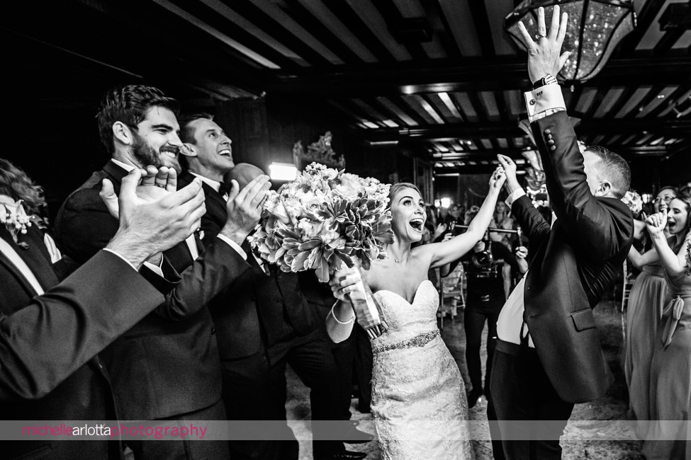 bride and groom cheer enter shadowbrook at Shrewsbury wedding reception