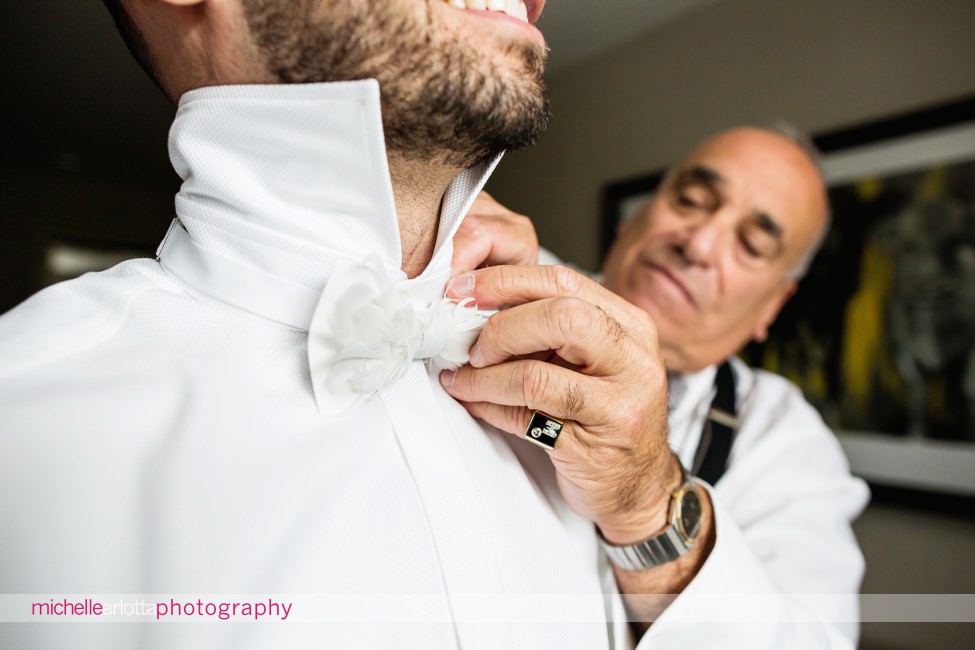 groom wears white feather bowtie for landmark venues stone house wedding
