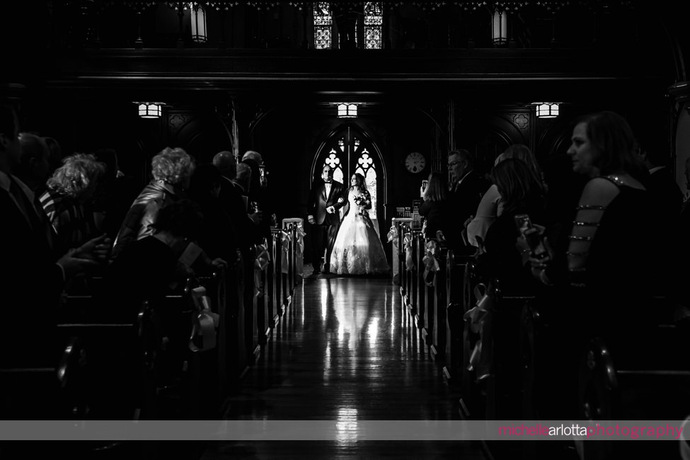bride walks down aisle at seton hall university chapel nj wedding
