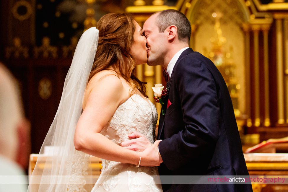  bride and groom kiss seton hall university chapel nj liberty house wedding