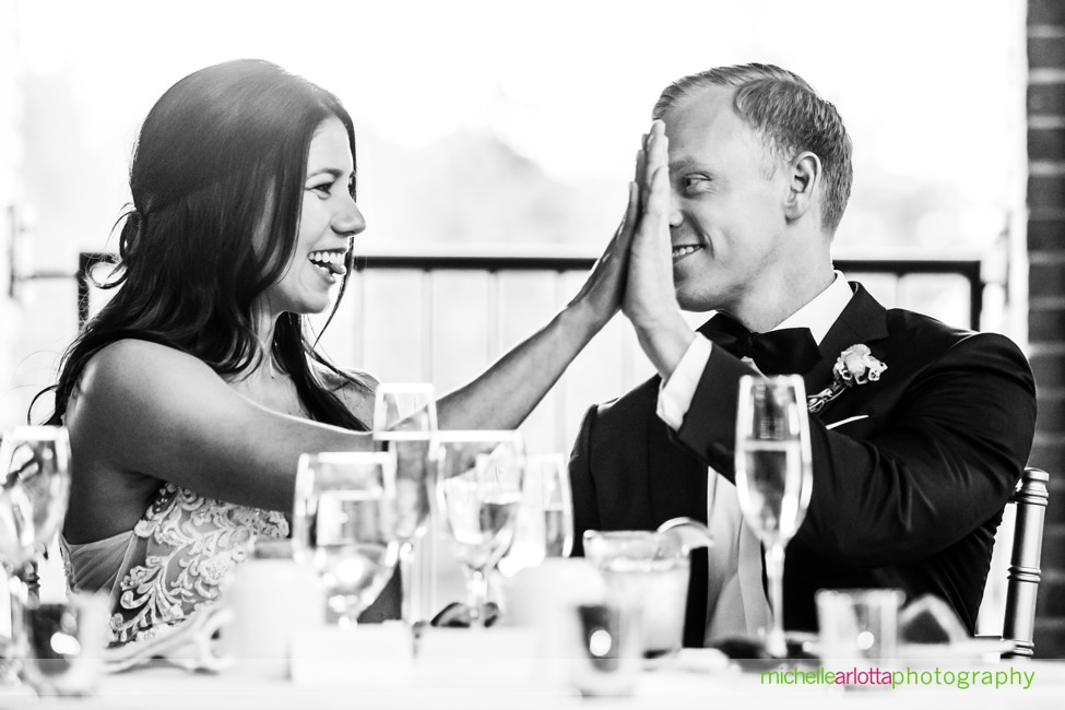 Saugerties Steamboat Co Wedding Hudson Valley NY bride and groom high five during toasts