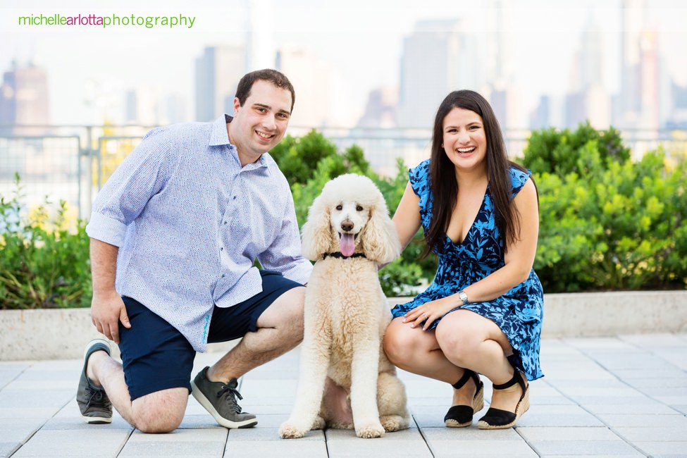 couple with standard poodle at Stevens institute Hoboken engagement session