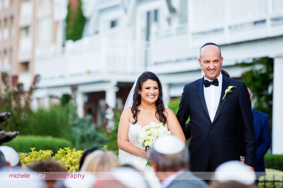 View on the Hudson NY outdoor wedding ceremony along Hudson river bride walking down aisle