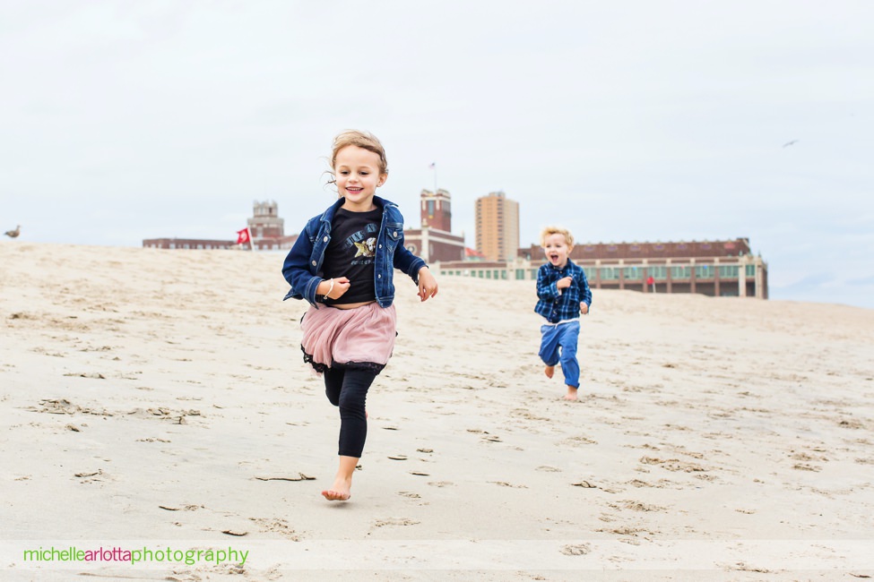 Asbury Park nj family photos brother and sister running on the beach