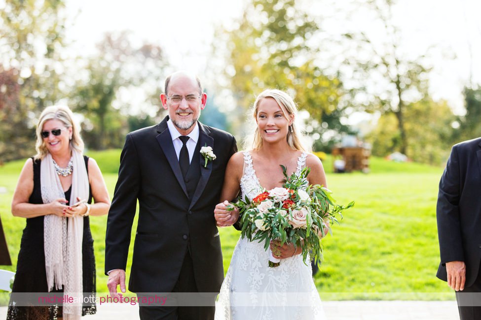 bear brook valley autumn outdoor wedding ceremony bride walking down aisle with father