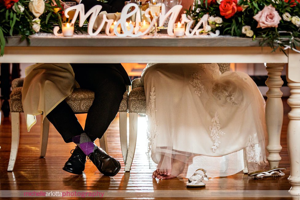 bear brook valley autumn wedding nj reception bride takes her sandals off during toasts