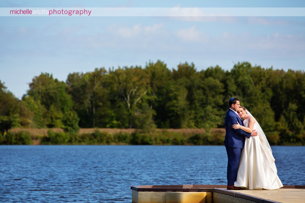 boathouse at mercer lake wedding New Jersey bride and groom portrait on dock