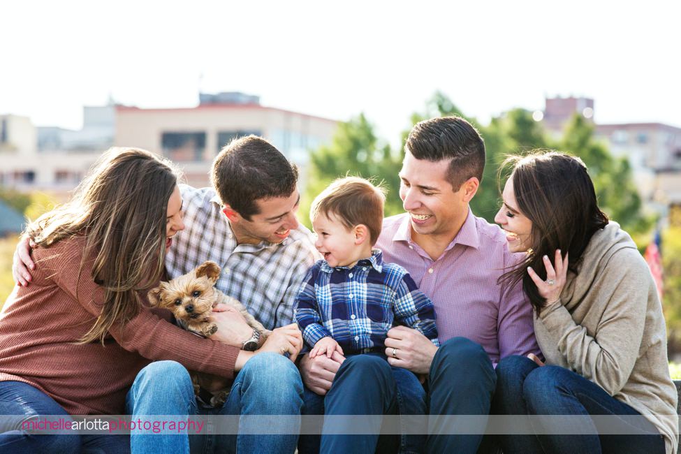 toddler with parents and aunt and uncle and dog Hoboken family session