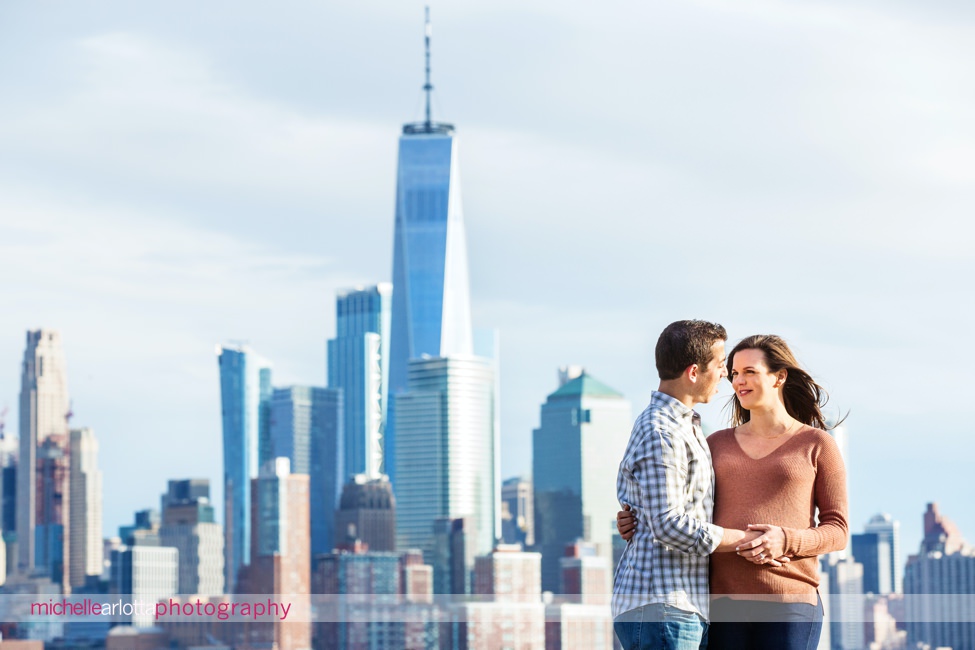 pregnant mom with husband and dog hoboken nyc skyline
