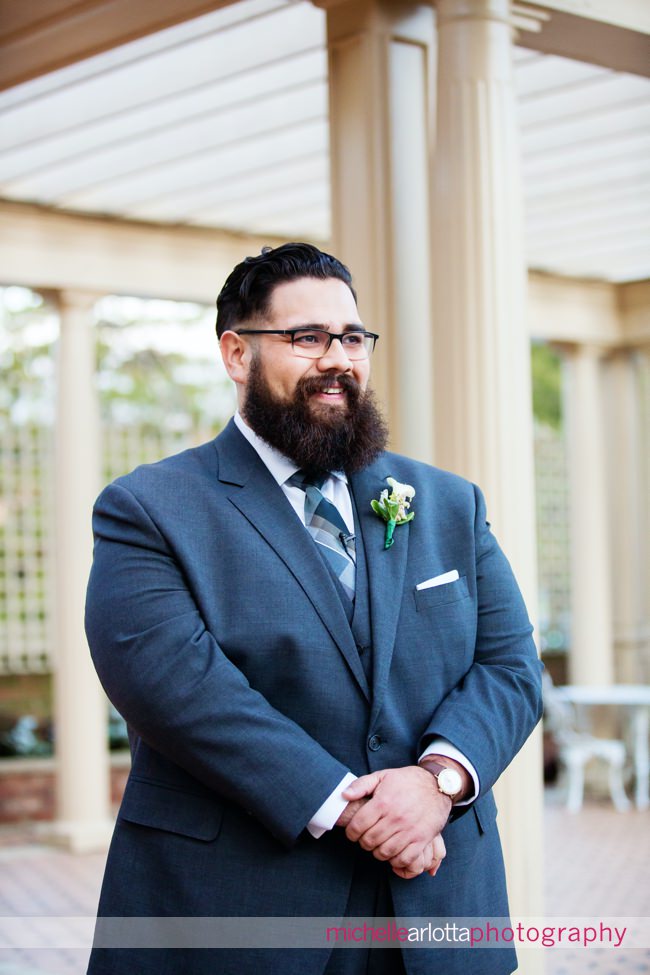 The manor NJ outdoor wedding ceremony groom watches bride walk down aisle