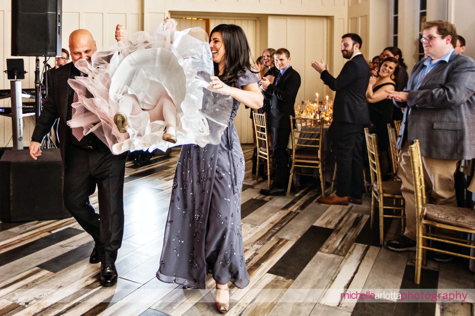 mid winter Ryland Inn coach house New Jersey wedding reception flower girl flung in the air during entrance