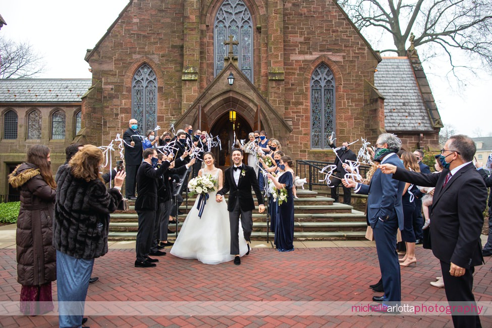 seton hall university chapel NJ winter wedding ceremony exit with streamers