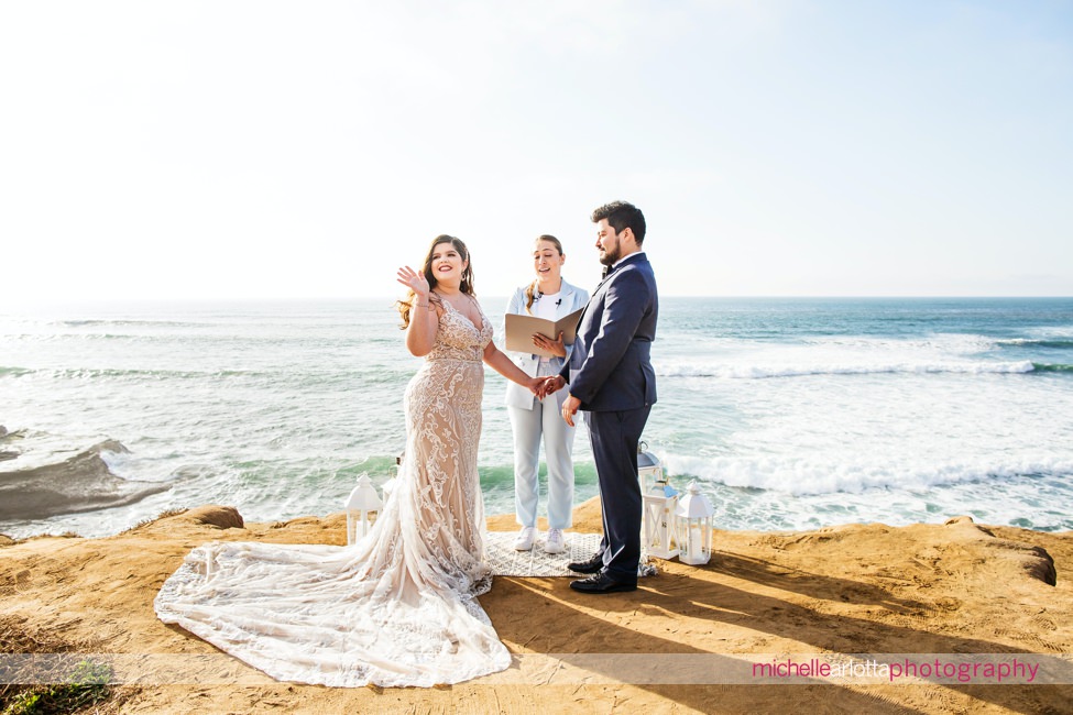 sunset cliffs San Diego intimate wedding ceremony bride waves to zoom crowd at home