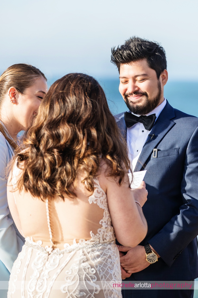 sunset cliffs San Diego intimate wedding ceremony groom laughing
