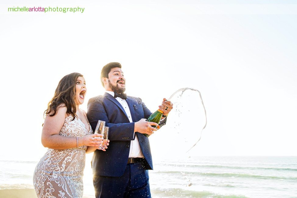 sunset cliffs San Diego intimate wedding bride and groom popping champagne