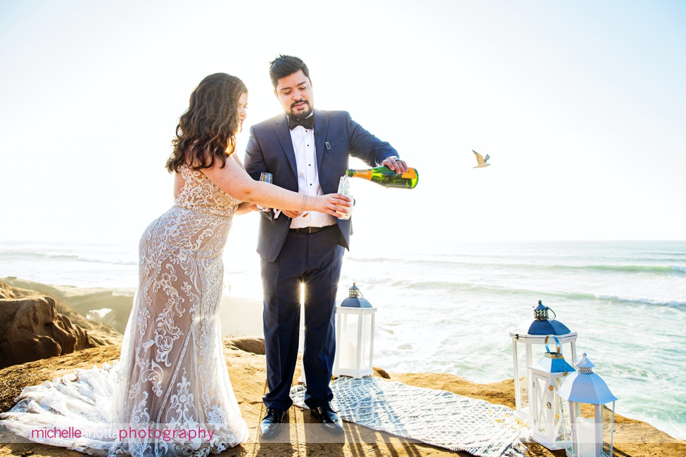 sunset cliffs San Diego intimate wedding ceremony pouring champagne