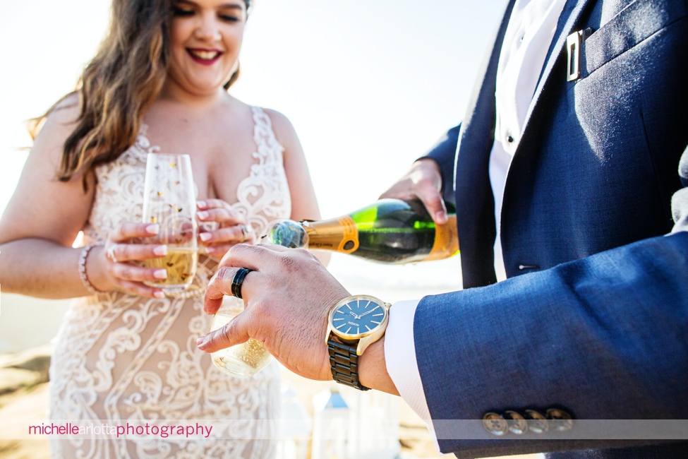 sunset cliffs San Diego intimate wedding ceremony pouring champagne