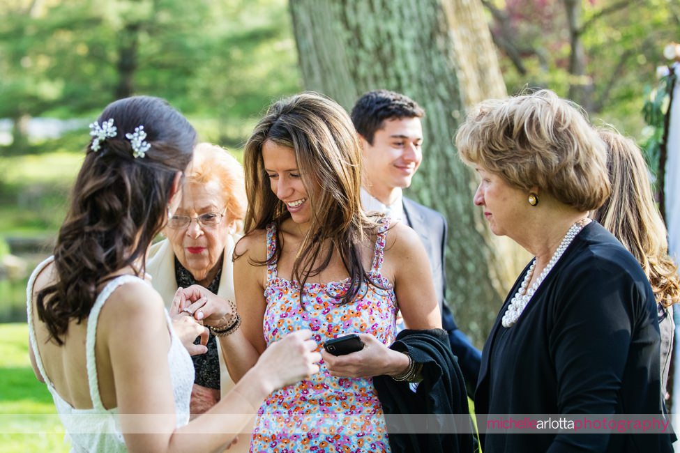 Appleford Estate Pennsylvania intimate wedding sister checks out bride's wedding ring