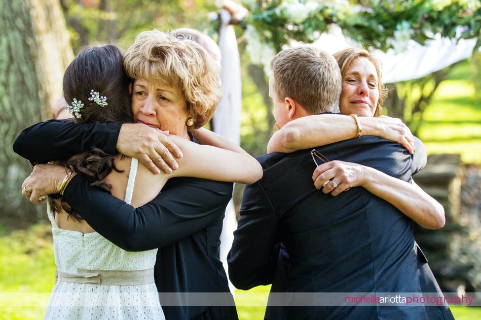 Appleford Estate Pennsylvania intimate wedding mothers hugging the bride and groom 