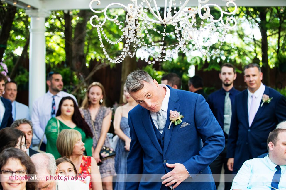 LBI gables NJ wedding ceremony groom ducks for chandelier