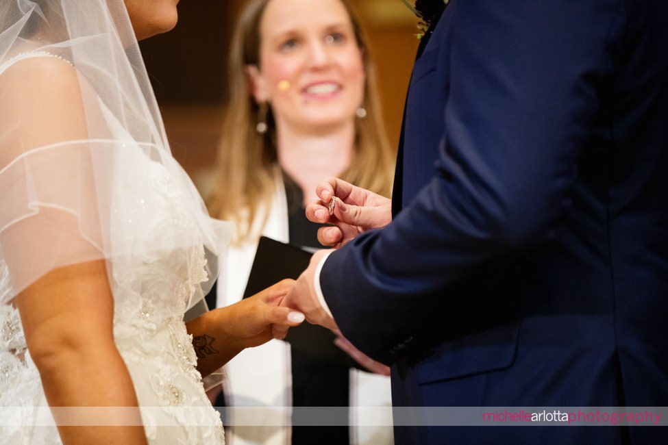 The Farmhouse wedding new jersey church ceremony groom holds wedding ring