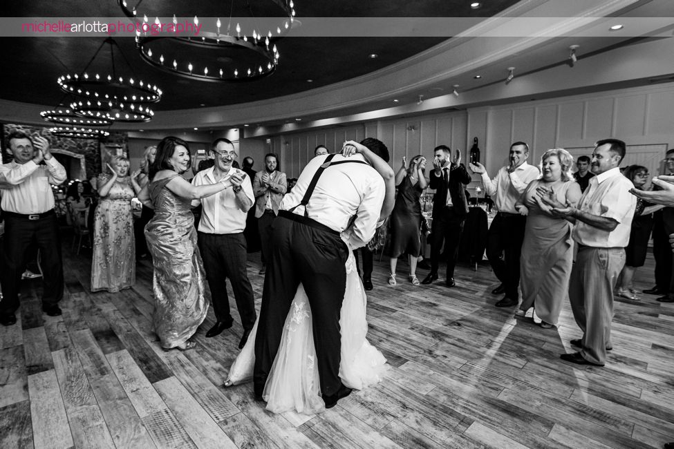 Landmark Venues The Farmhouse wedding new jersey wedding reception groom kisses and dips bride once dance floor