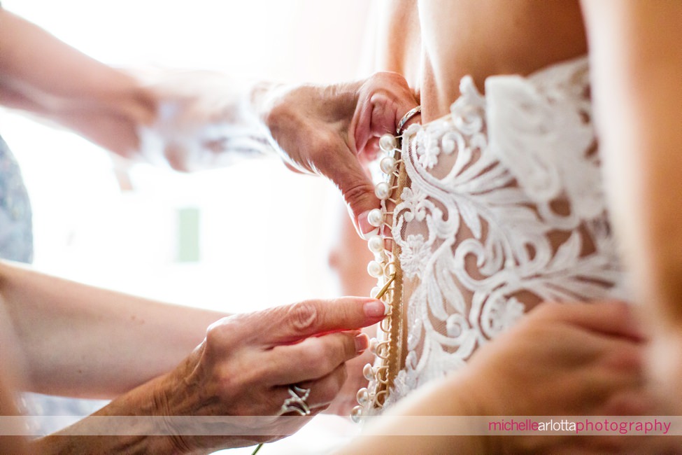 Crystal Point Yacht Club bride prep detail of dress