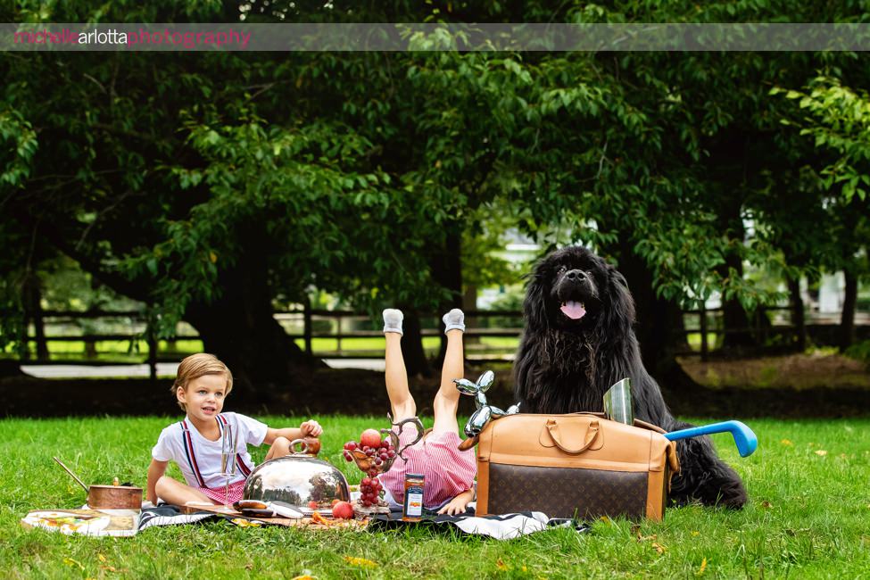 NJ candid family photography picnic with a Newfoundland dog