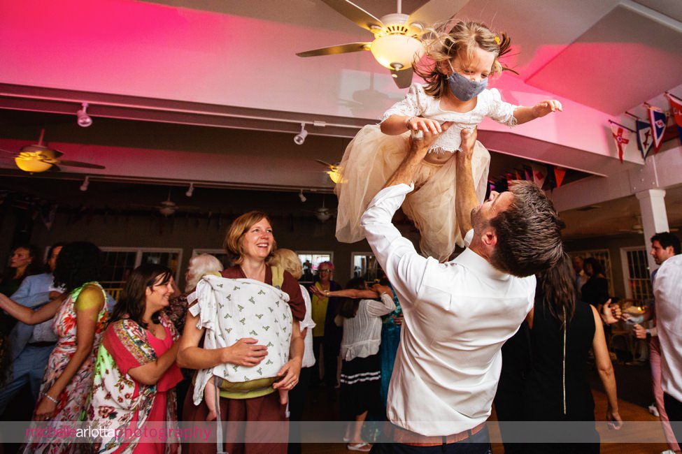 Brant Beach yacht Club LBI NJ wedding reception little girl being held up high int he air
