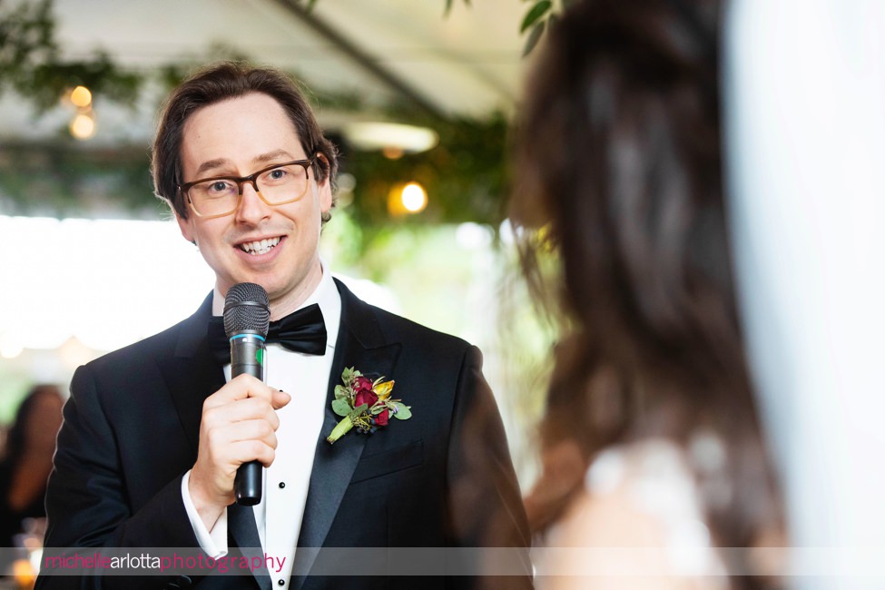 New Jersey backyard wedding tented ceremony groom reads vows