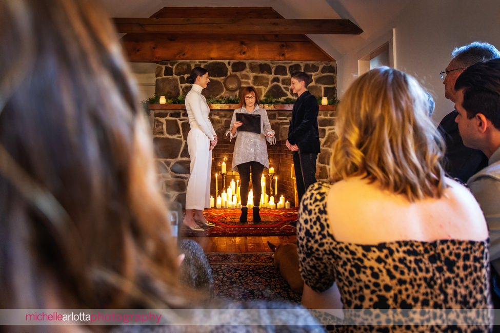 intimate same sex Hunterdon County NJ wedding ceremony in front of fireplace