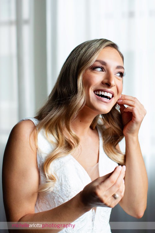 Notary Hotel wedding bride prep putting on earrings