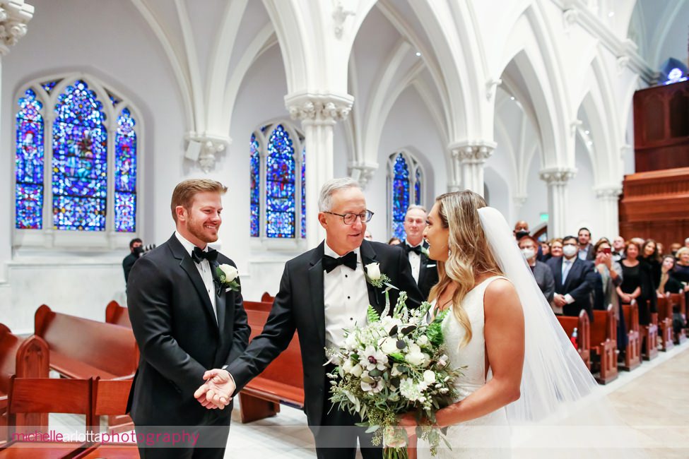 St. Thomas of Villanova church wedding father shakes groom's hand at end of aisle