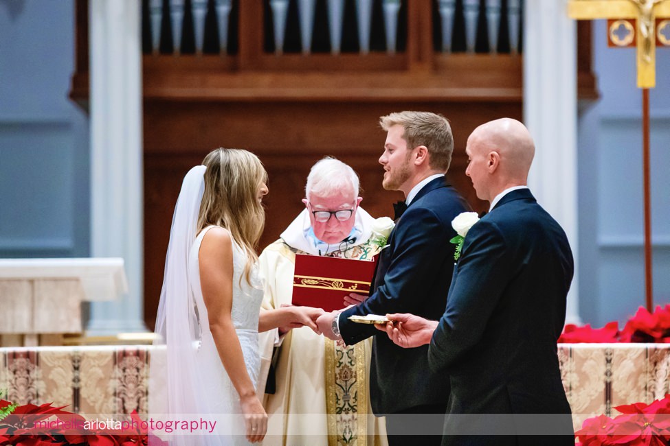 St. Thomas of Villanova church wedding bride and groom exchange rings