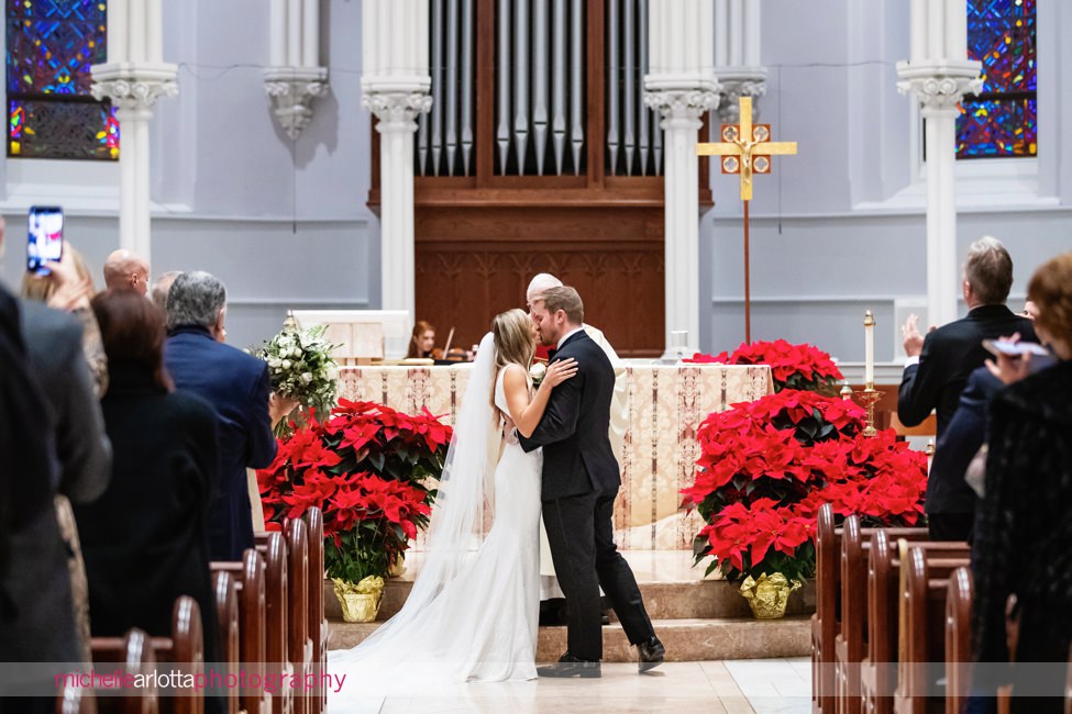 St. Thomas of Villanova church wedding bride and groom kiss