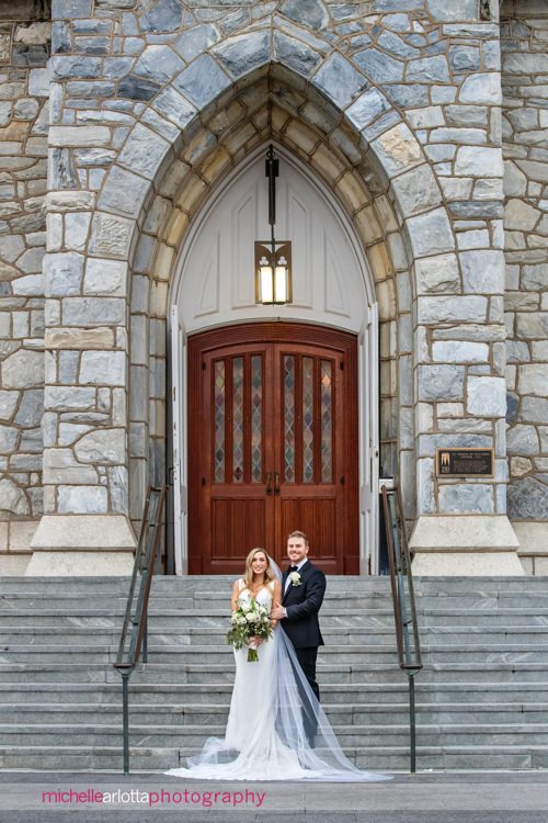 St. Thomas of Villanova church wedding bride and groom portrait outside of church