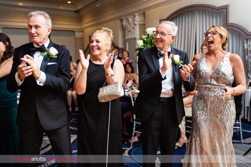 The Notary Hotel Pennsylvania wedding parents cheering on bride and groom as they enter the reception