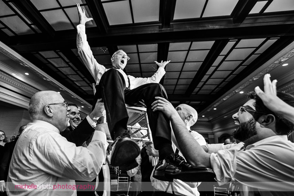 The Notary Hotel PA wedding reception dancing father of bride raised up into air on chair