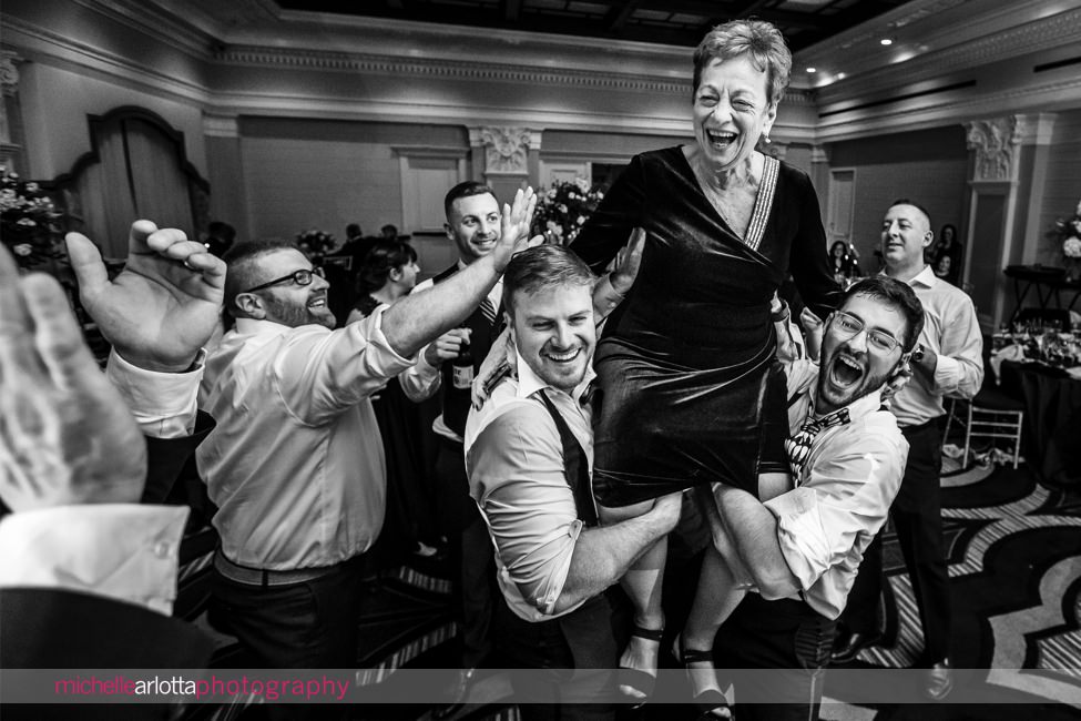 The Notary Hotel PA wedding reception dancing grandmother being raised up by groom and guests