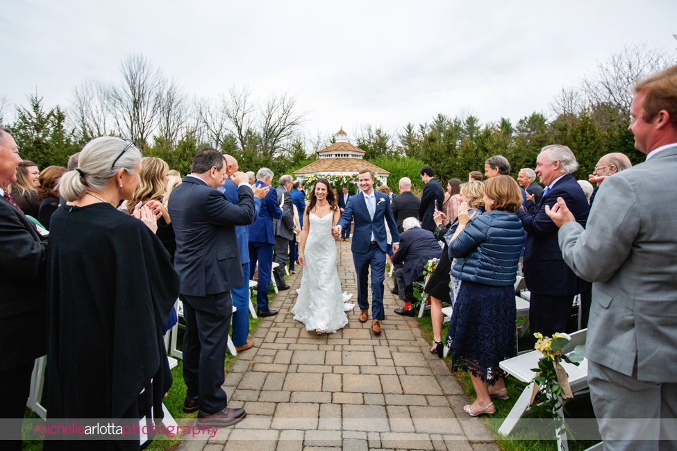 Landmark Venues The Farmhouse NJ outdoor spring wedding ceremony bride and groom exiting wedding