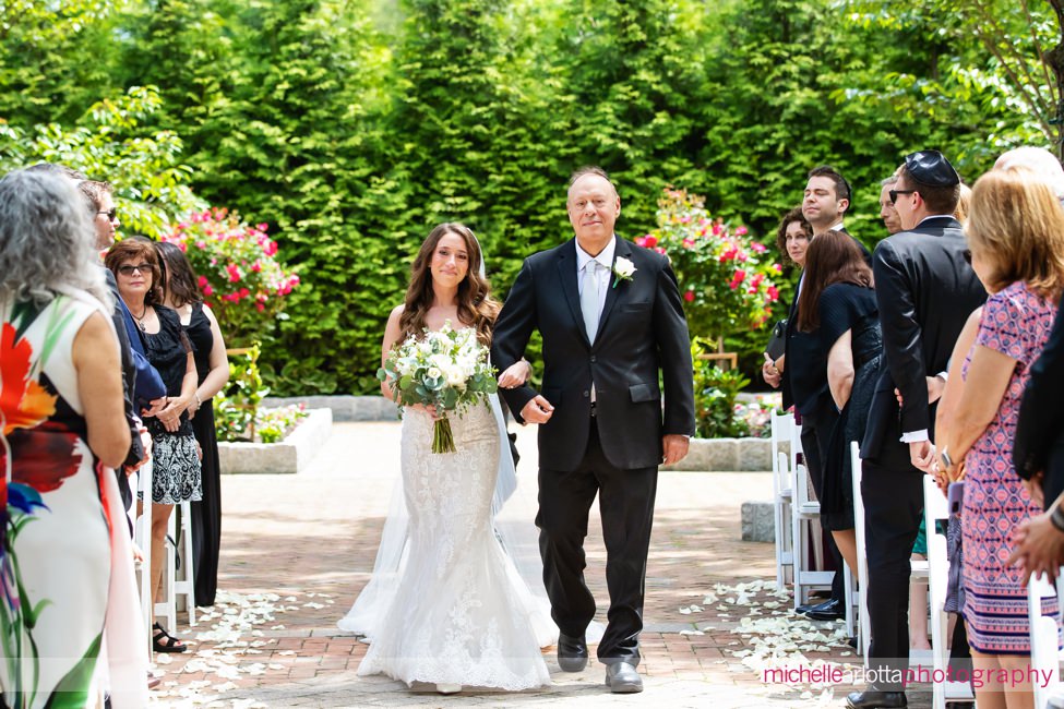 outdoor NJ wedding ceremony at Florentine Gardens bride walking down the aisle with father