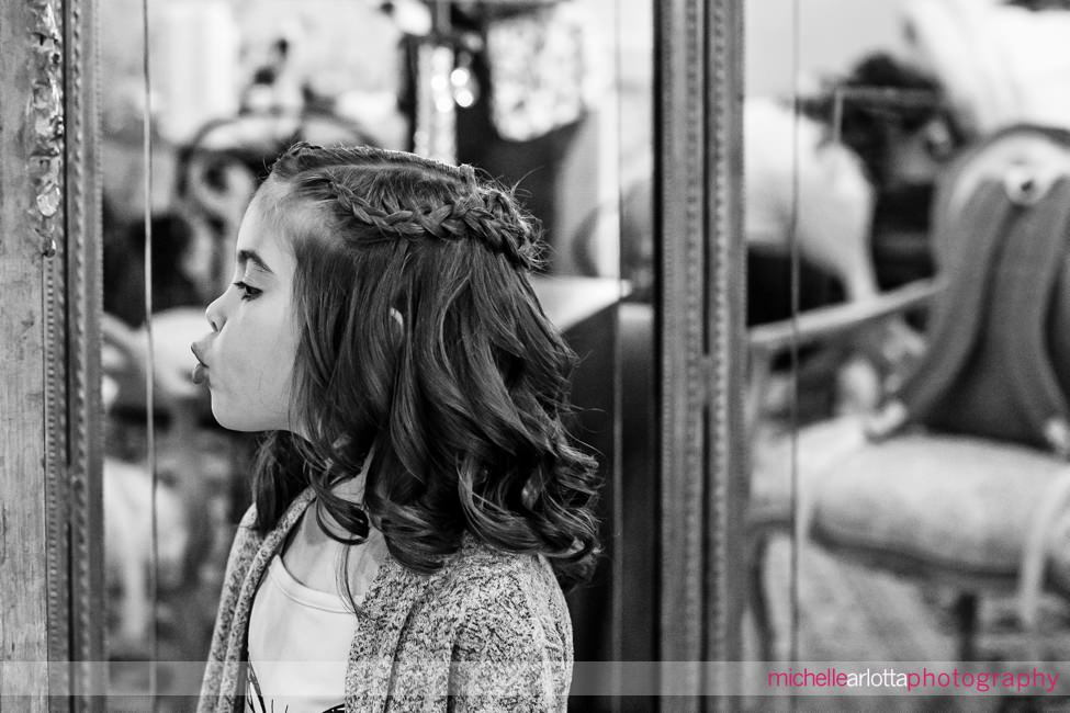 North Shore House NJ flower girl checks herself out in the mirror