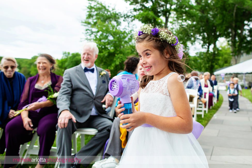 North Shore House lake outdoor wedding ceremony NJ flower girl with bubble gun