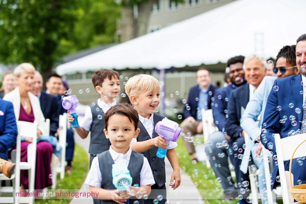 North Shore House lake outdoor wedding ceremony NJ ring bearers with bubble gun