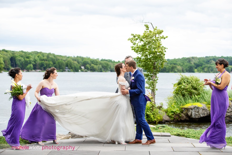 North Shore House lake outdoor wedding ceremony NJ bride and groom kiss
