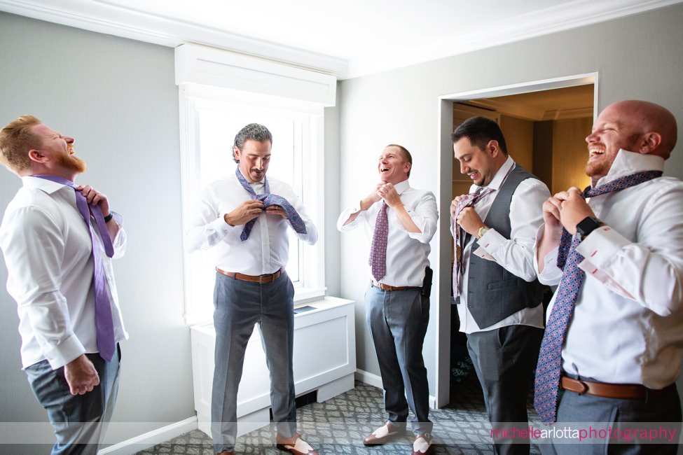 Park Avenue club New Jersey groomsmen laughing as they get ready