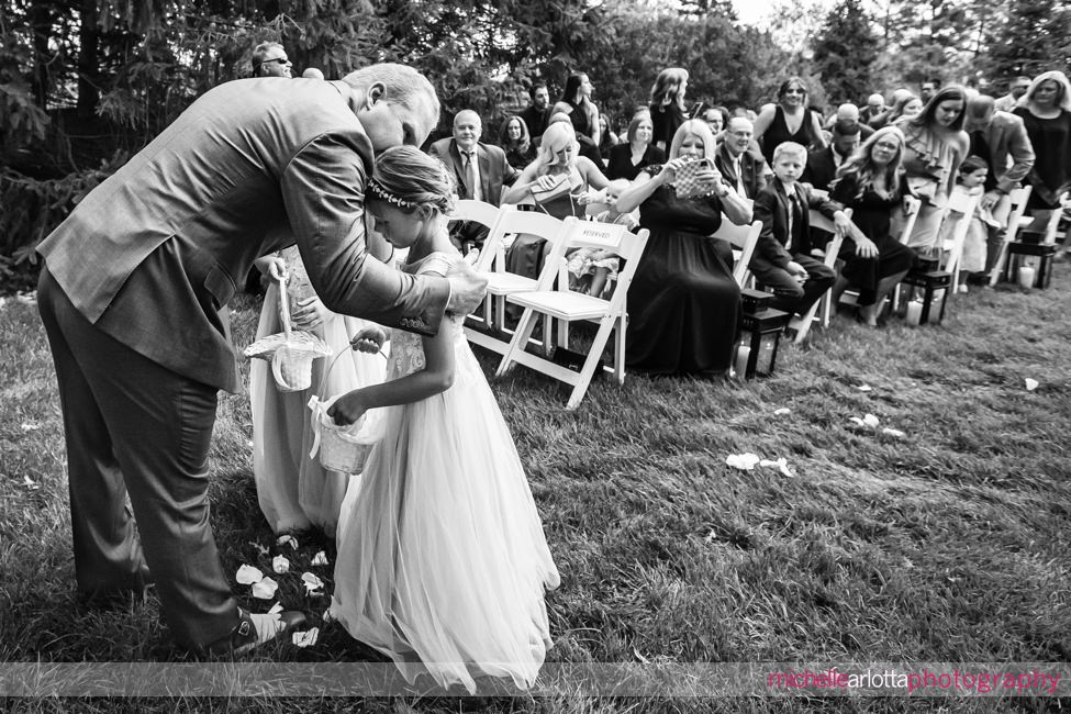 Park Avenue Club New Jersey outdoor wedding ceremony groom kissing stepdaughter at the end of the aisle